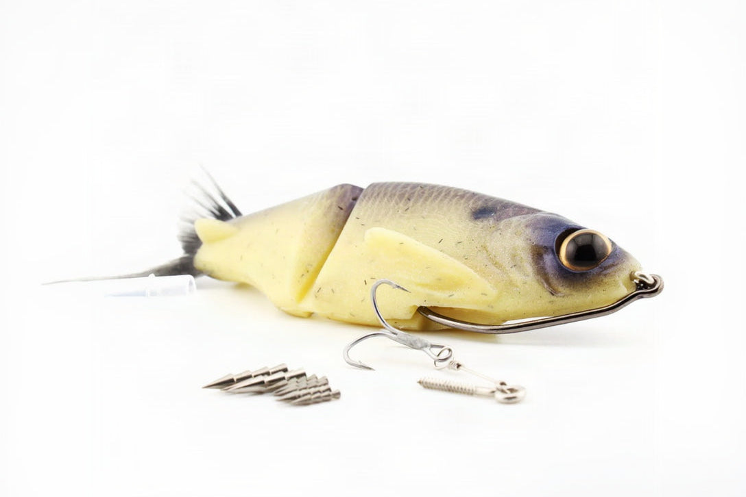 Soft Dad silicone glide bait in Dry Bones color shown with weedless hook, bottom treble rig and removable tungsten weights.